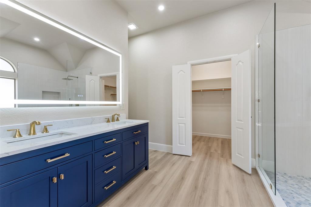 615 West Aurora Vista Trail Aurora, TX 76078 - Photo 21 of 40 a spacious bathroom with a granite countertop sink mirror and