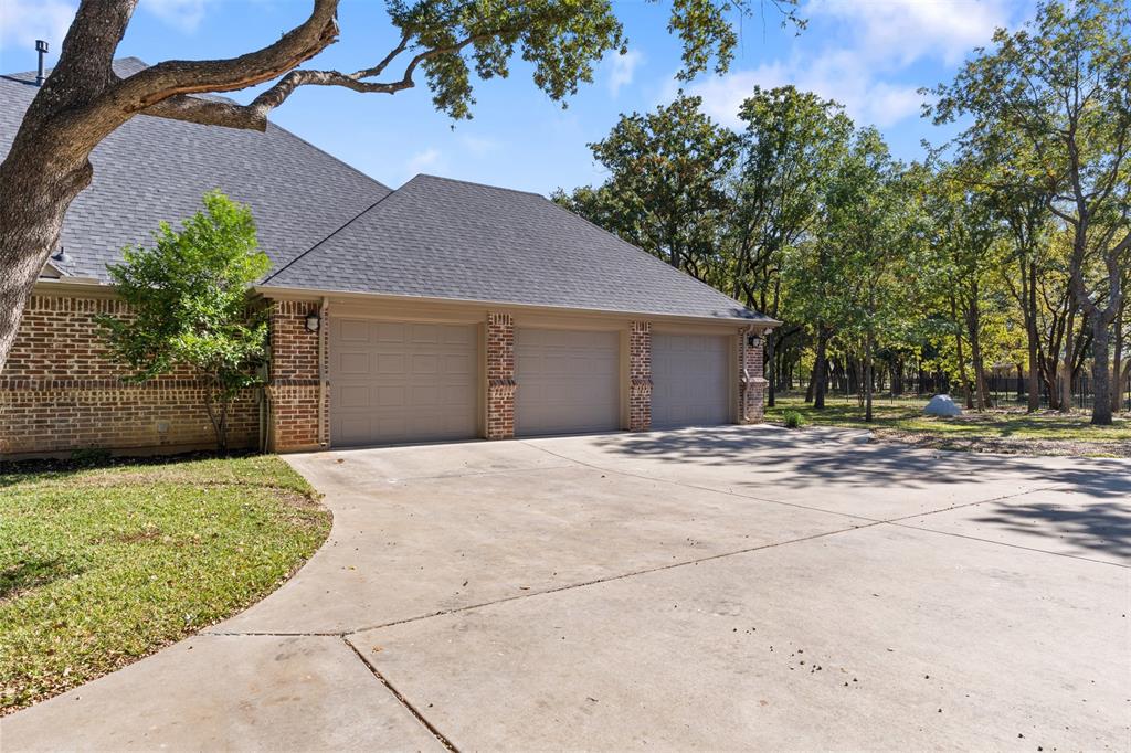 615 West Aurora Vista Trail Aurora, TX 76078 - Photo 36 of 40 a front view of a house with a yard and garage