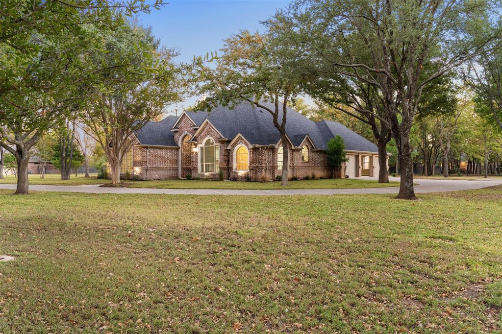 615 West Aurora Vista Trail Aurora, TX 76078 - Photo 37 of 40 a front view of house with yard and trees