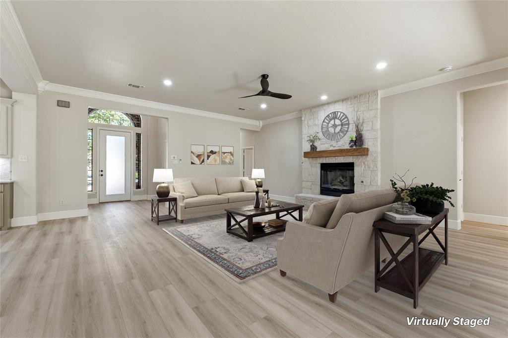 615 West Aurora Vista Trail Aurora, TX 76078 - Photo 5 of 40 a living room with furniture a fireplace and a flat screen tv