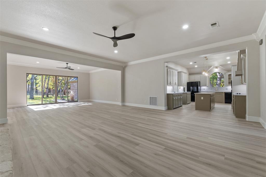 615 West Aurora Vista Trail Aurora, TX 76078 - Photo 8 of 40 a view of a livingroom with a furniture wooden floor and a window