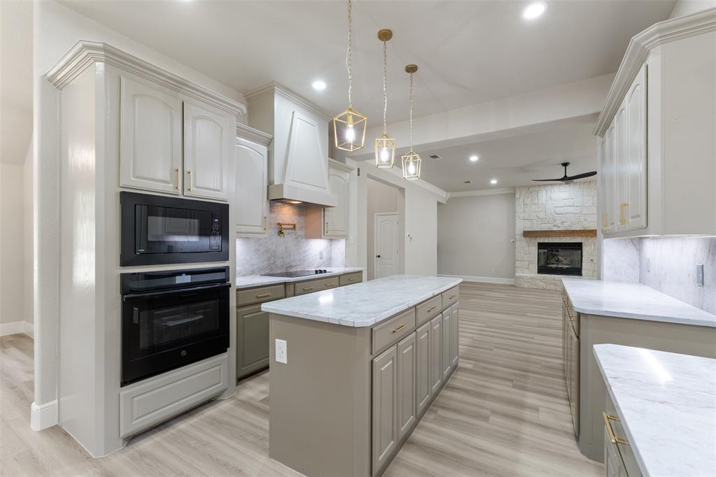 615 West Aurora Vista Trail Aurora, TX 76078 - Photo 40 of 40 a kitchen with a sink stainless steel appliances and cabinets