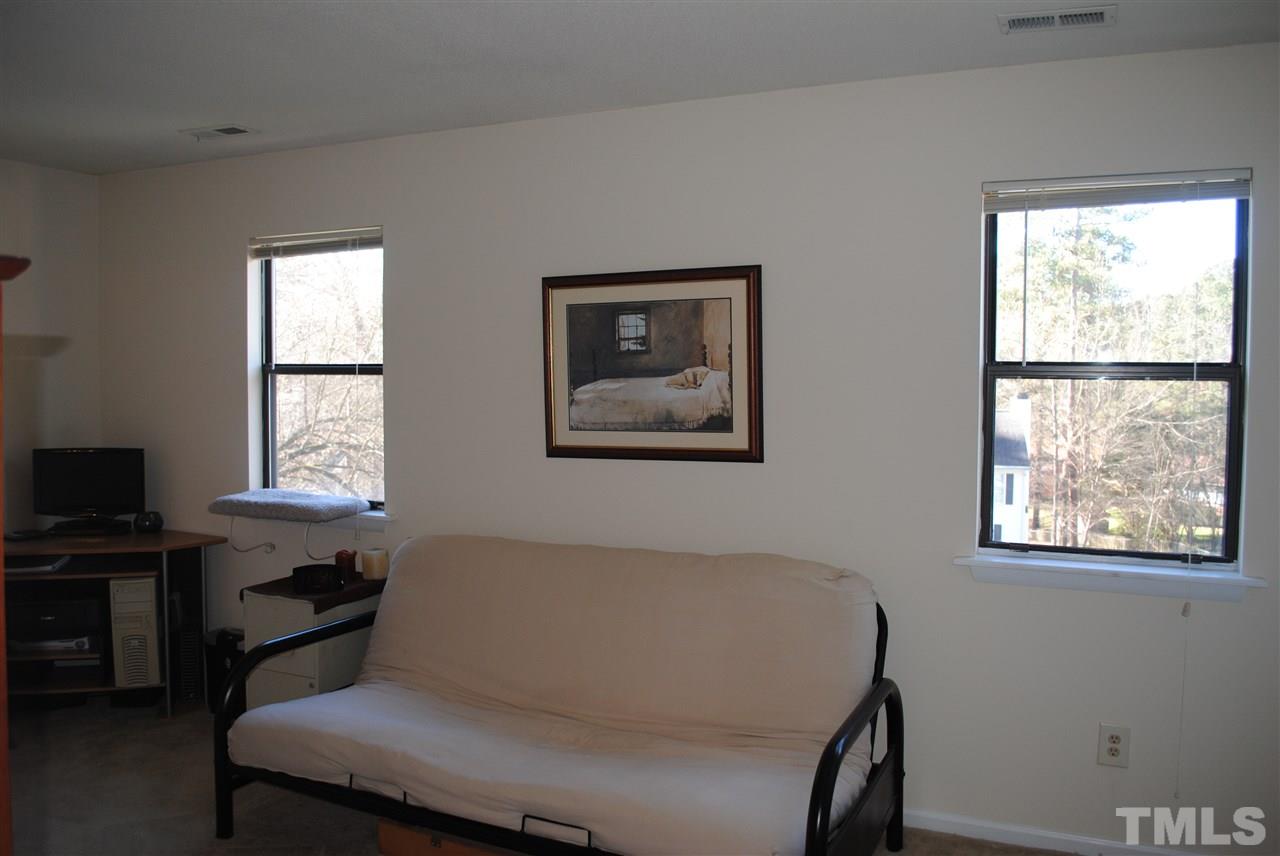 5408 Ridgeloch Place Raleigh, NC 27612 - Photo 21 of 25 a bedroom with a bed and a window