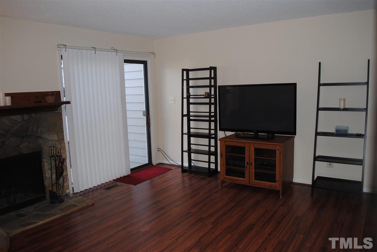 5408 Ridgeloch Place Raleigh, NC 27612 - Photo 9 of 25 a view of a livingroom with furniture and wooden floor