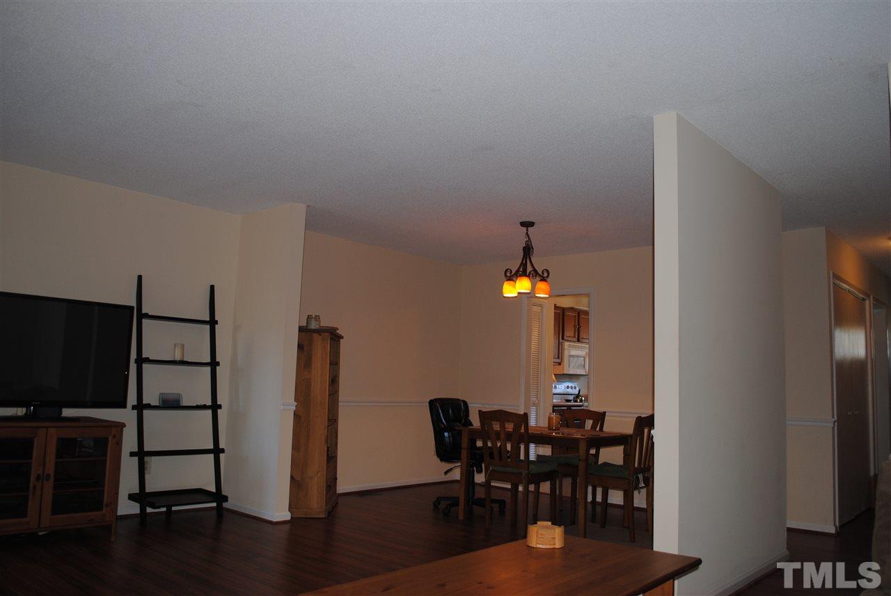 5408 Ridgeloch Place Raleigh, NC 27612 - Photo 10 of 25 a dining room with furniture and wooden floor