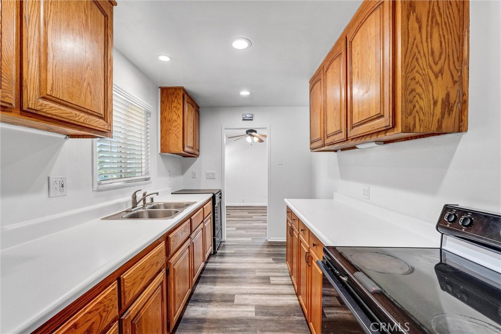 9246 Rowell Avenue Chatsworth, CA 91311 - Photo 12 of 22 a kitchen with stainless steel appliances granite countertop a sink and a stove