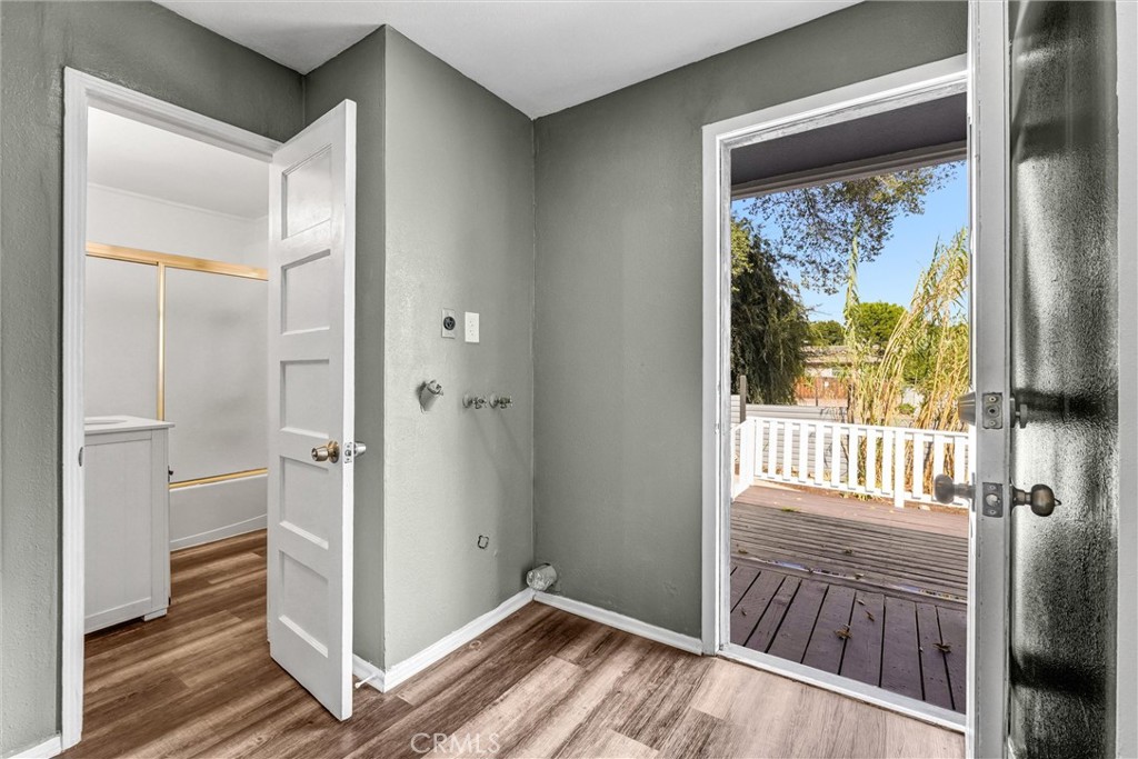 9246 Rowell Avenue Chatsworth, CA 91311 - Photo 19 of 22 a view of a hallway with wooden floor and a bedroom