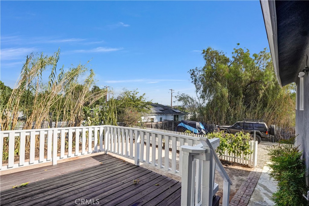 9246 Rowell Avenue Chatsworth, CA 91311 - Photo 22 of 22 a view of a roof with wooden floor and fence