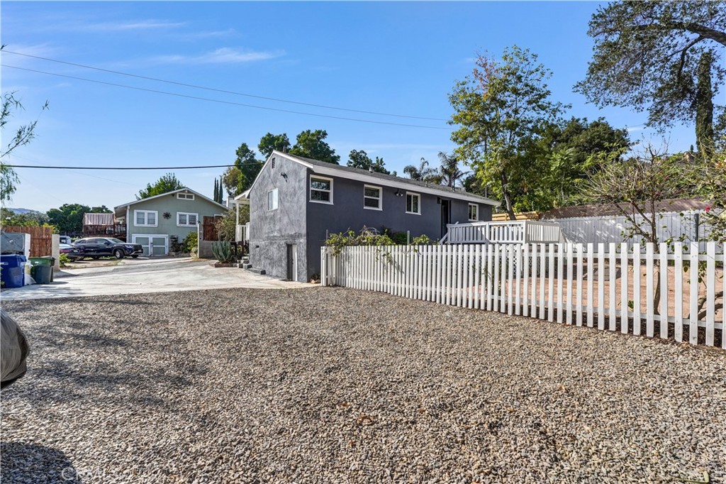 9246 Rowell Avenue Chatsworth, CA 91311 - Photo 5 of 22 a front view of a house with a yard