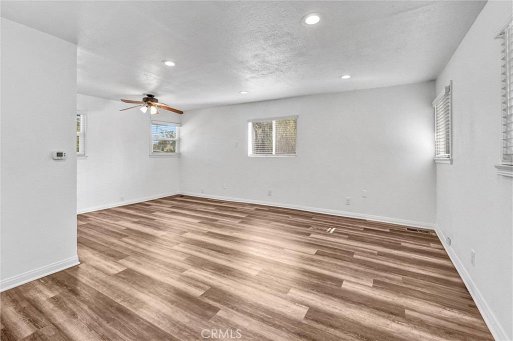 9246 Rowell Avenue Chatsworth, CA 91311 - Photo 6 of 22 a view of empty room with wooden floor
