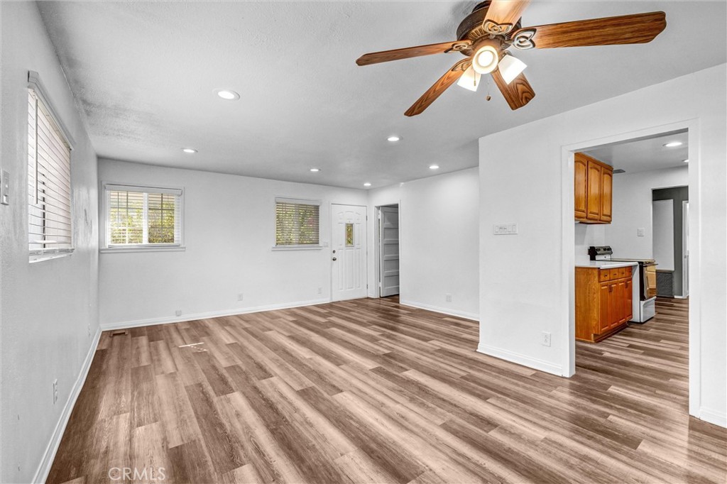 9246 Rowell Avenue Chatsworth, CA 91311 - Photo 7 of 22 a view of a bedroom with a bed ceiling fan and window