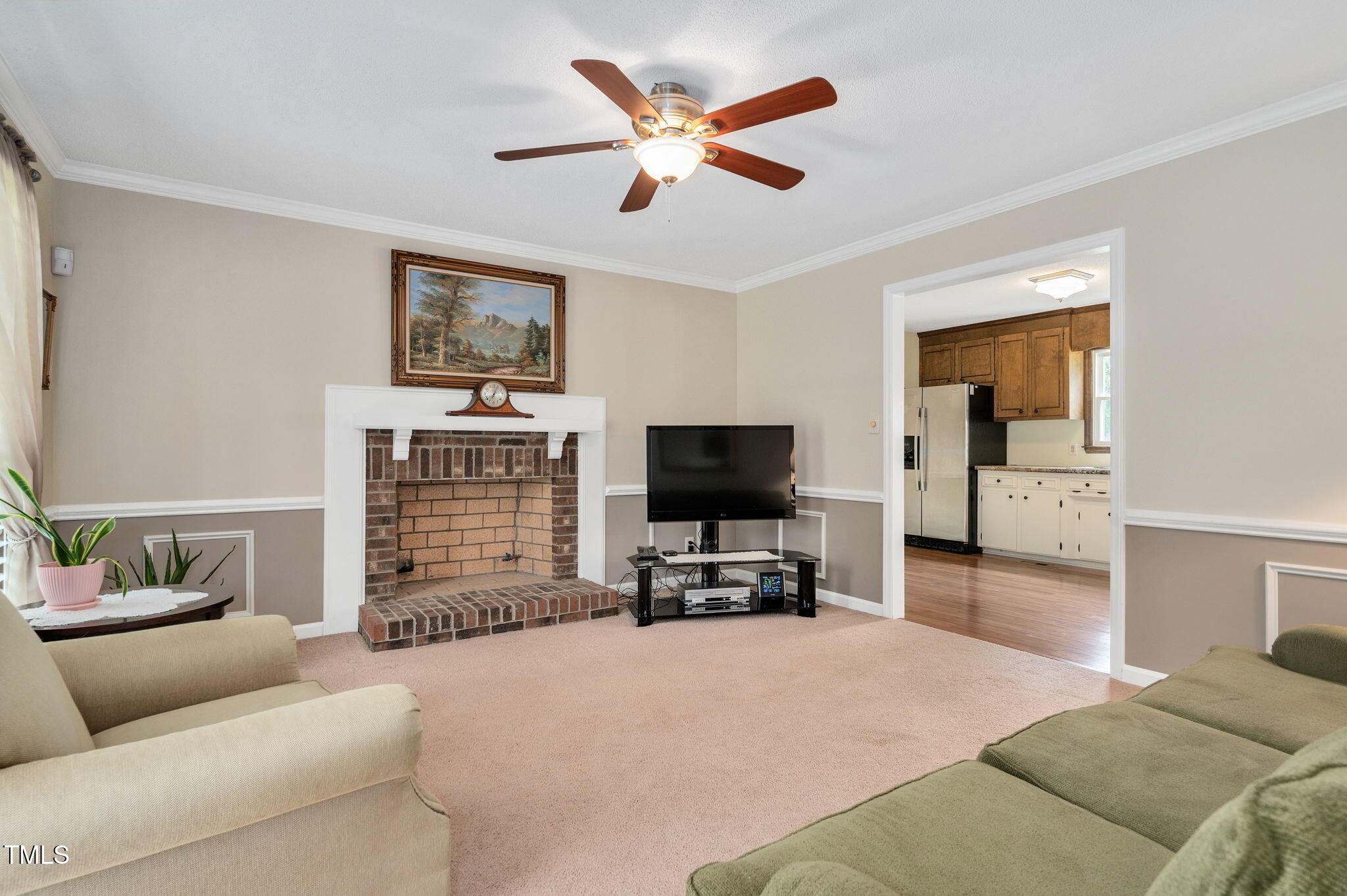 124 Windmere Drive Angier, NC 27501 - Photo 13 of 39 a living room with furniture and a flat screen tv