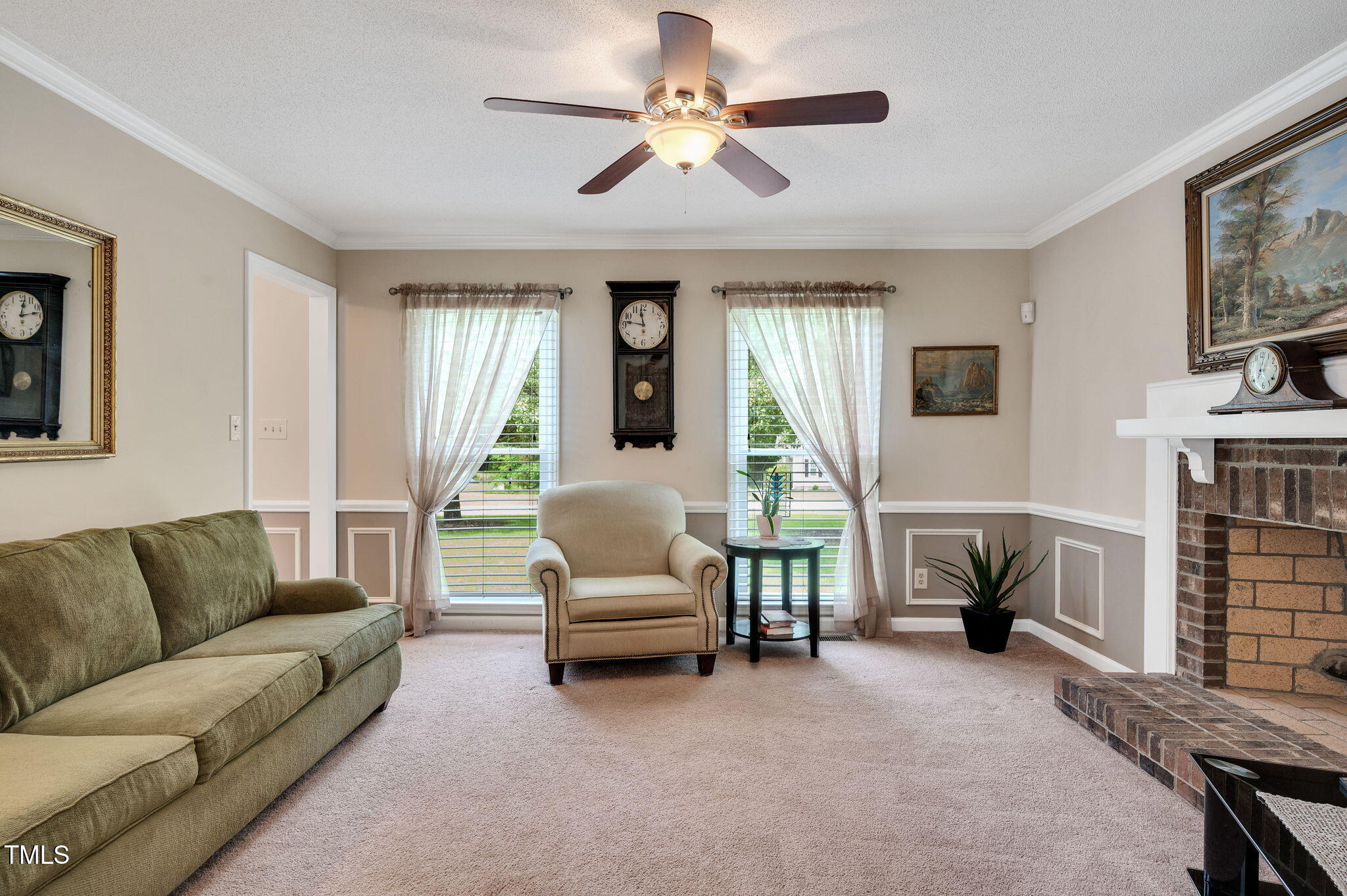 124 Windmere Drive Angier, NC 27501 - Photo 15 of 39 a living room with furniture and a fireplace