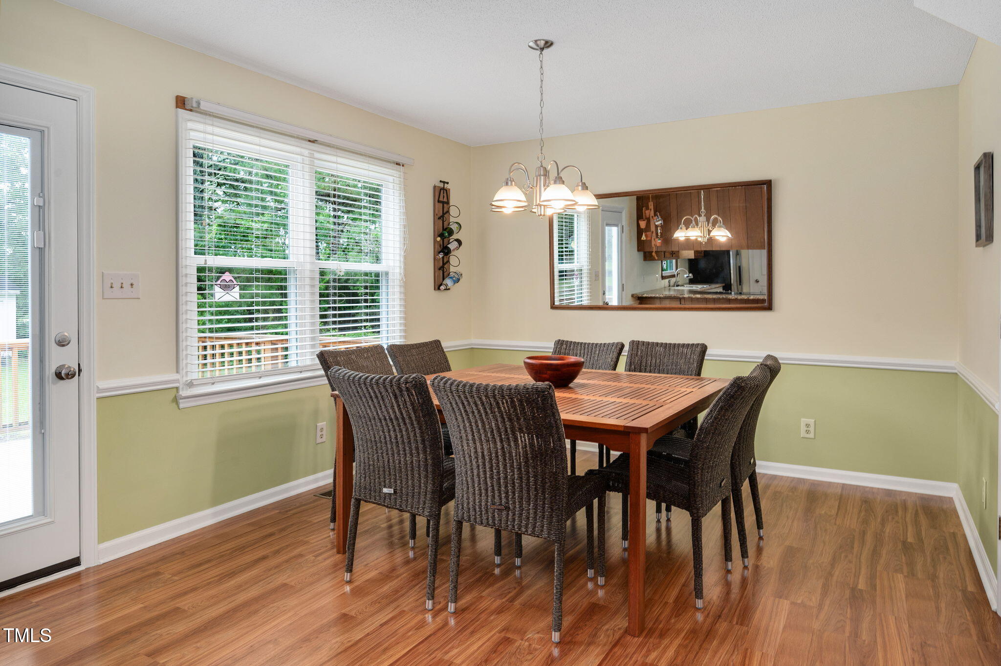 124 Windmere Drive Angier, NC 27501 - Photo 19 of 39 a view of a dining room with furniture window and wooden floor
