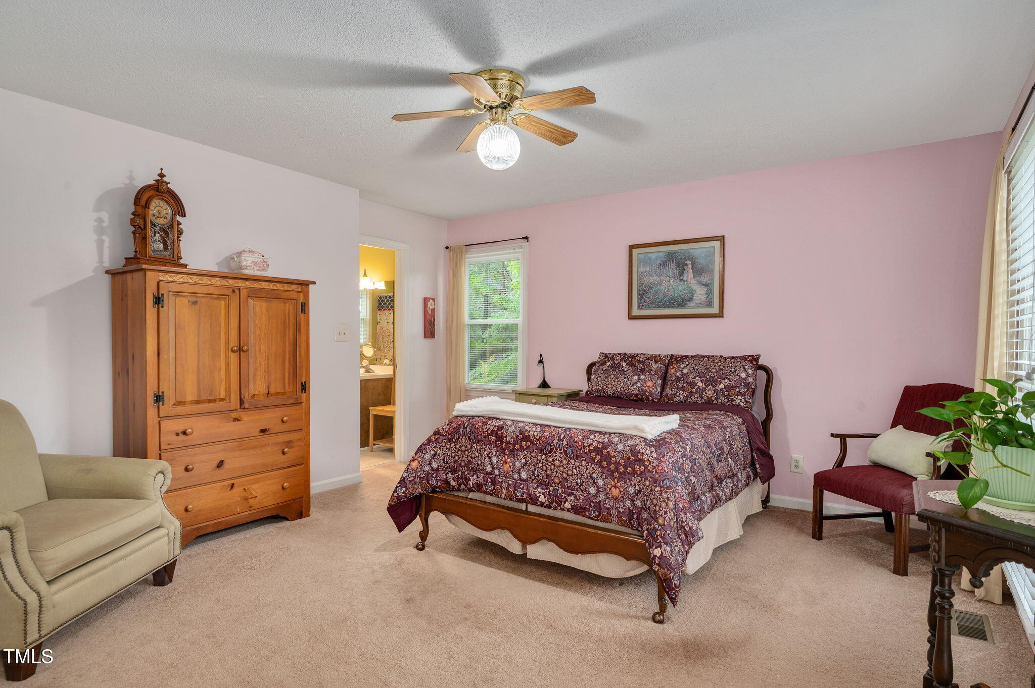124 Windmere Drive Angier, NC 27501 - Photo 23 of 39 a spacious bedroom with a bed and a couch