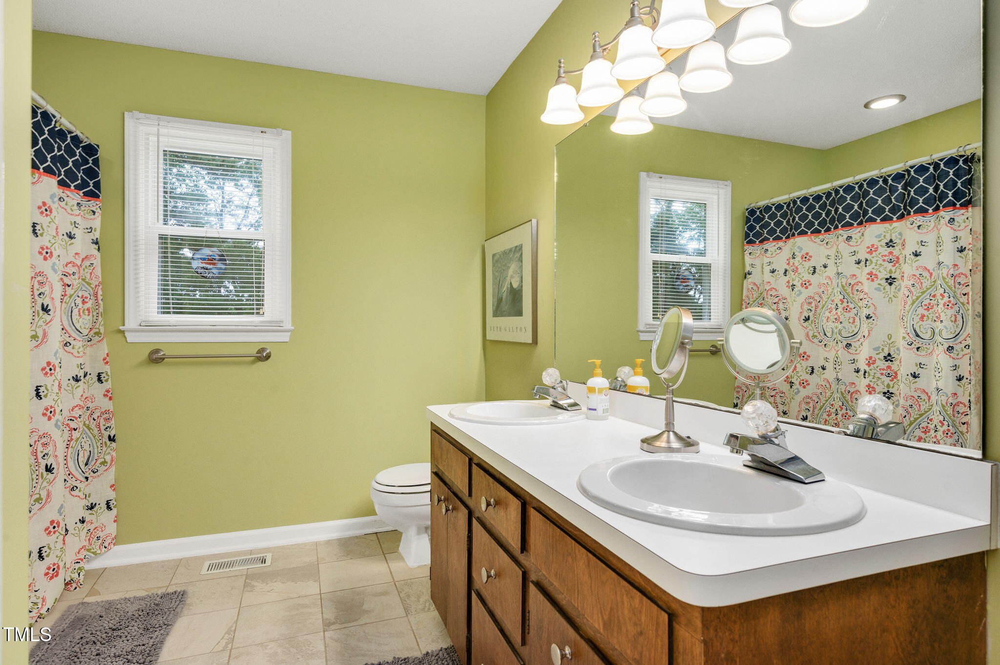 124 Windmere Drive Angier, NC 27501 - Photo 25 of 39 a bathroom with a sink and a mirror
