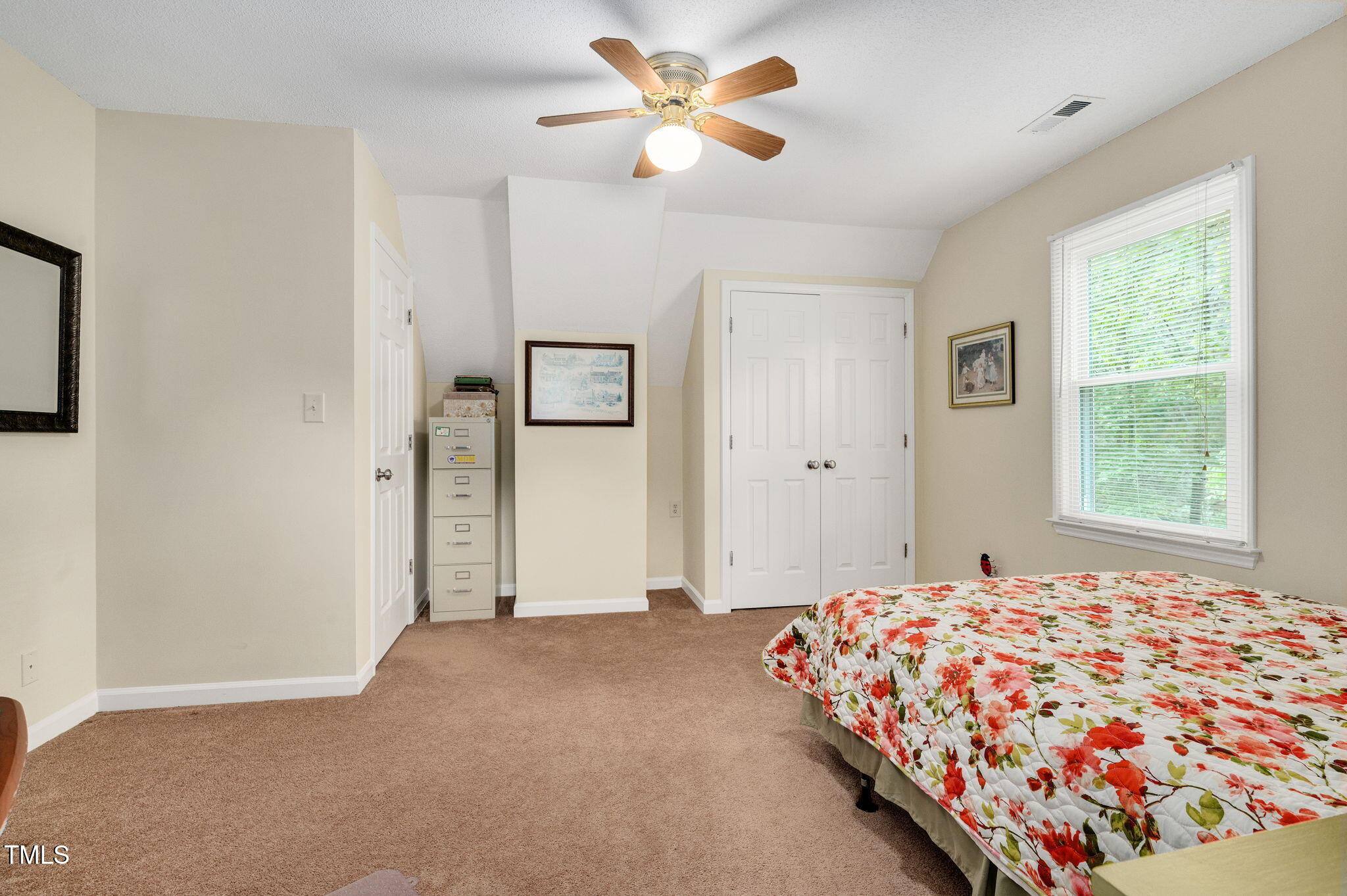 124 Windmere Drive Angier, NC 27501 - Photo 27 of 39 a bedroom with a bed and a window