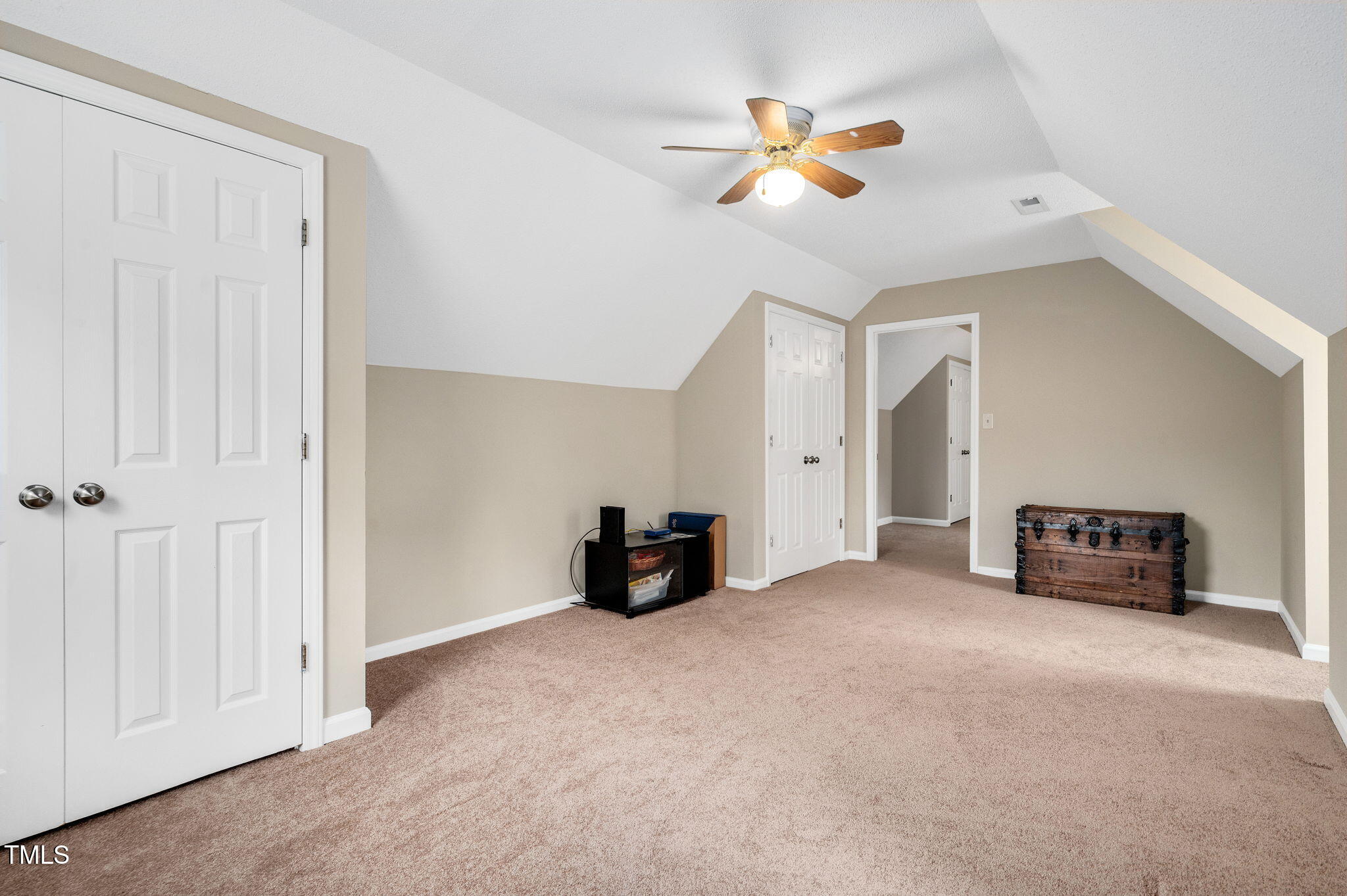 124 Windmere Drive Angier, NC 27501 - Photo 32 of 39 an empty room with windows and fan