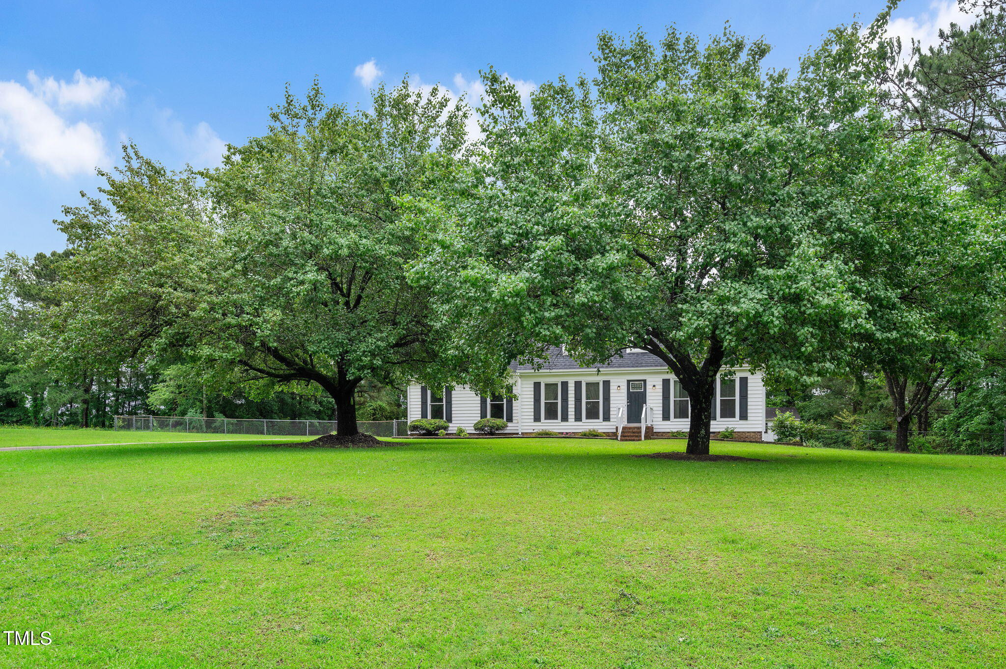 124 Windmere Drive Angier, NC 27501 - Photo 3 of 39 a house view with swimming pool in front of it