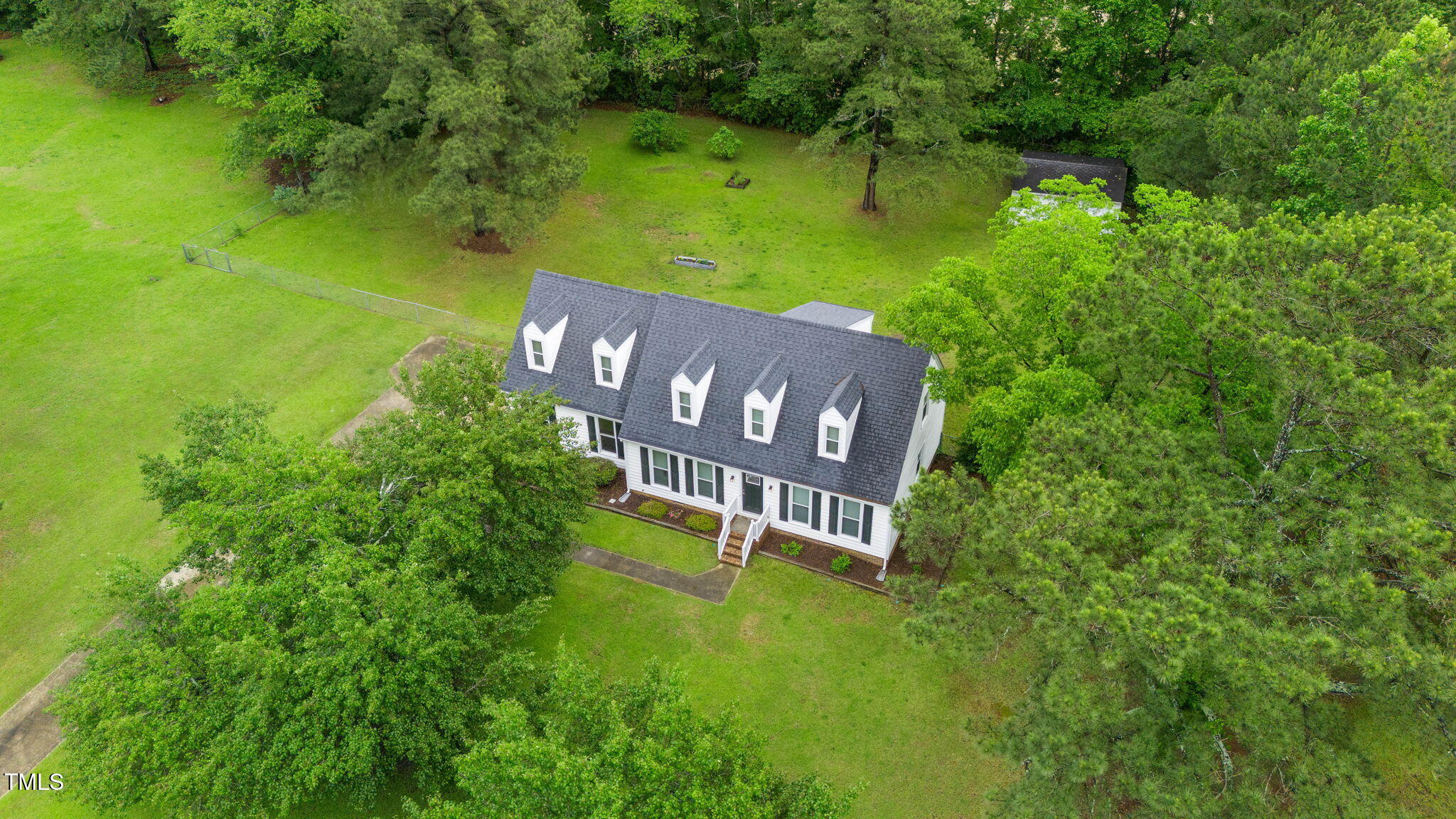 124 Windmere Drive Angier, NC 27501 - Photo 4 of 39 a view of a house with a yard and a pond
