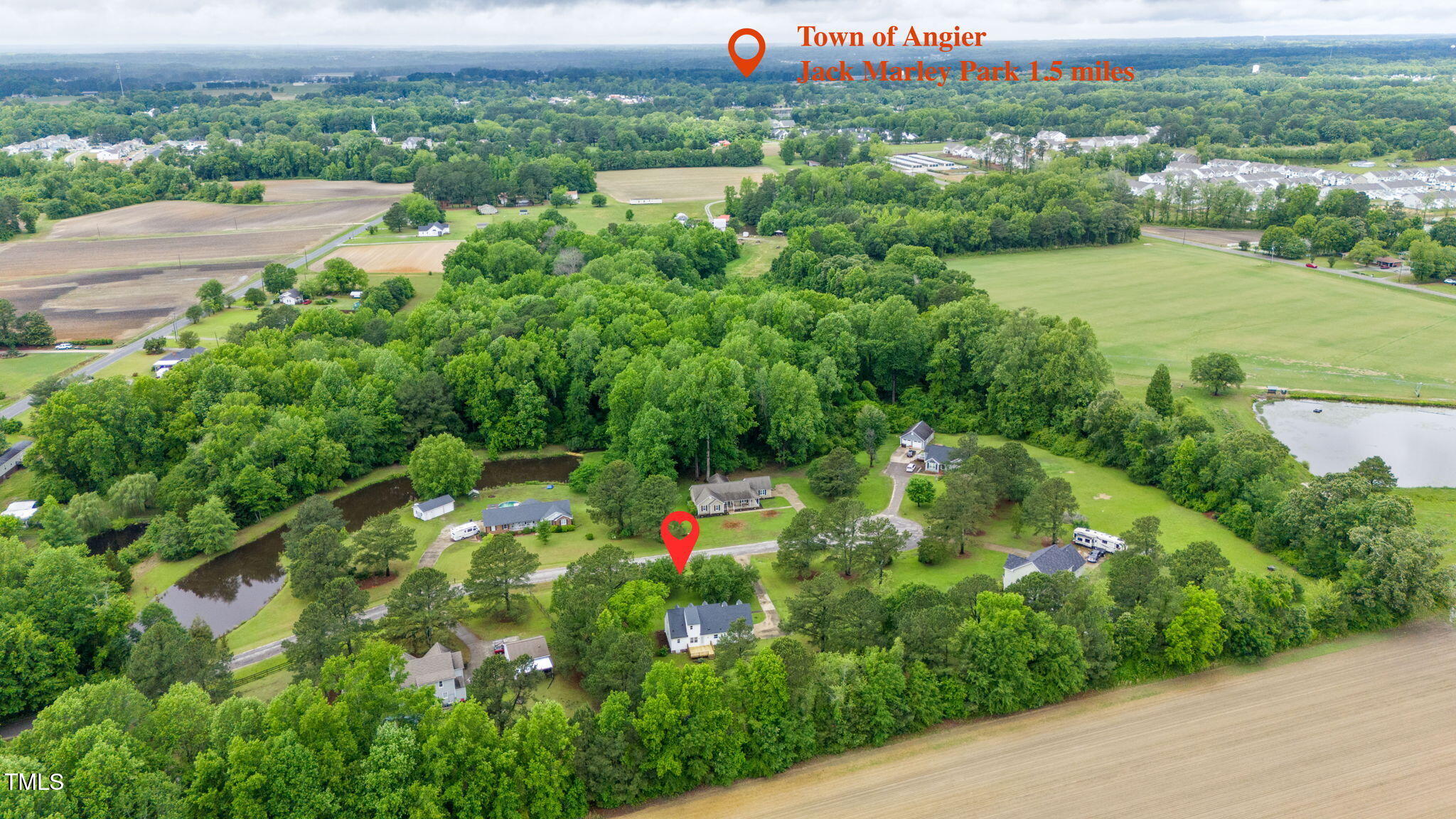 124 Windmere Drive Angier, NC 27501 - Photo 6 of 39 an aerial view of residential houses with outdoor space and trees
