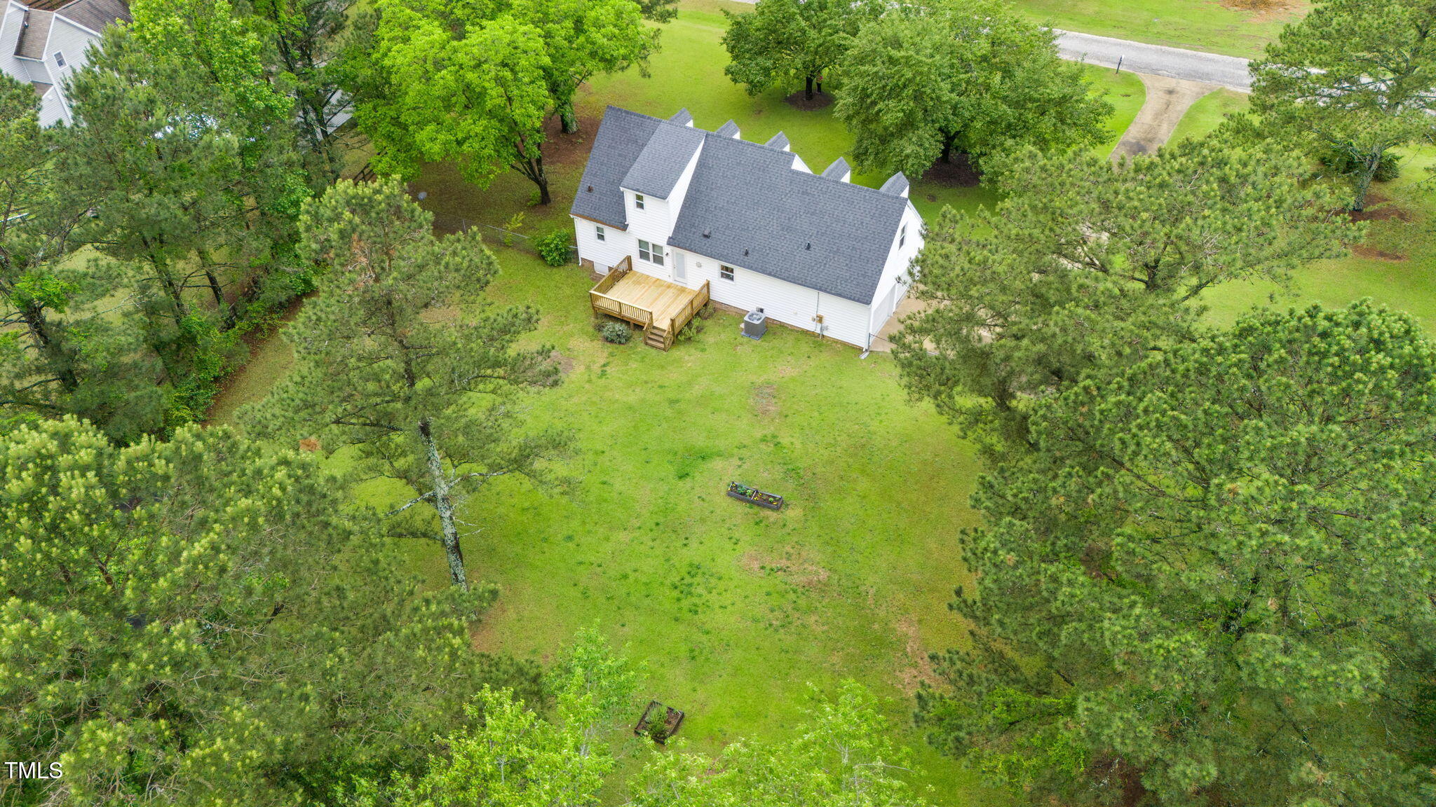 124 Windmere Drive Angier, NC 27501 - Photo 9 of 39 an aerial view of residential house with outdoor space and trees all around
