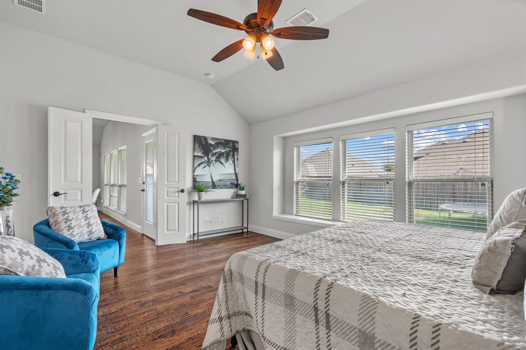 1609 Emerald Tree Place Aubrey, TX 76227 - Photo 15 of 39 a bed room with a bed and a large window