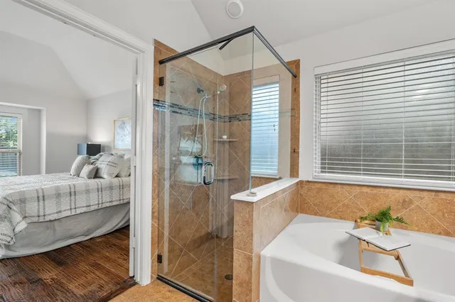 a bathroom with a tub and a shower