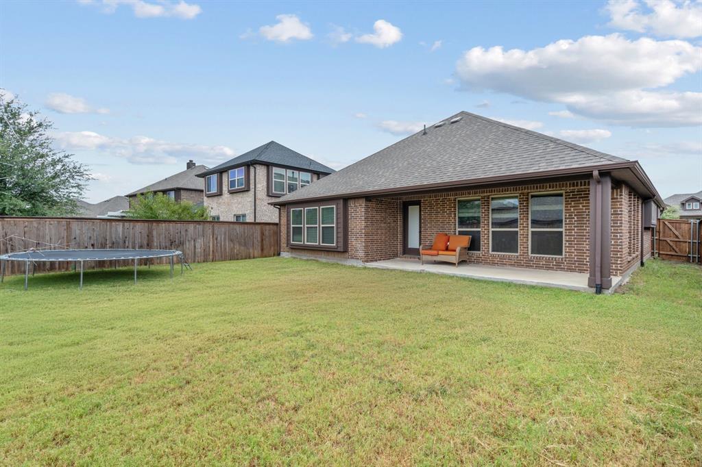 1609 Emerald Tree Place Aubrey, TX 76227 - Photo 30 of 39 a front view of a house with garden