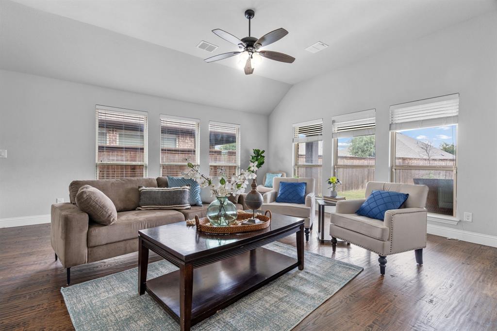 1609 Emerald Tree Place Aubrey, TX 76227 - Photo 10 of 39 a living room with furniture and wooden floor