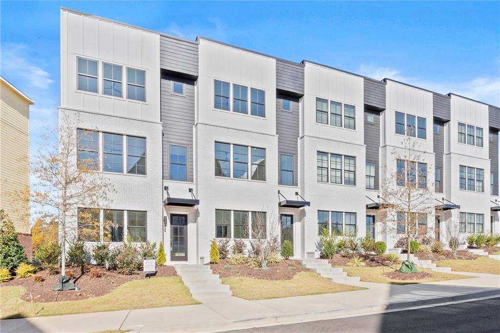 437 Mezzo Lane, Unit 87 Alpharetta, GA 30009 - Photo 1 of 46 a front view of a building with street view