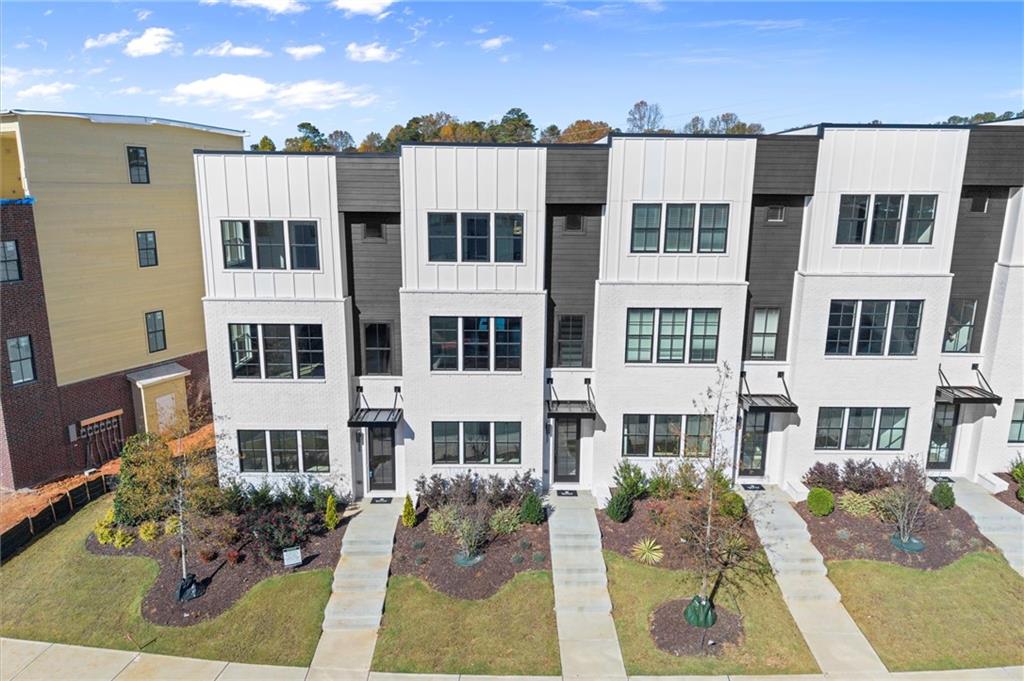 437 Mezzo Lane, Unit 87 Alpharetta, GA 30009 - Photo 2 of 46 a front view of a multi story building