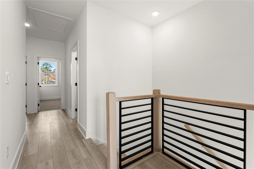 437 Mezzo Lane, Unit 87 Alpharetta, GA 30009 - Photo 21 of 46 a view of a hallway with wooden floor
