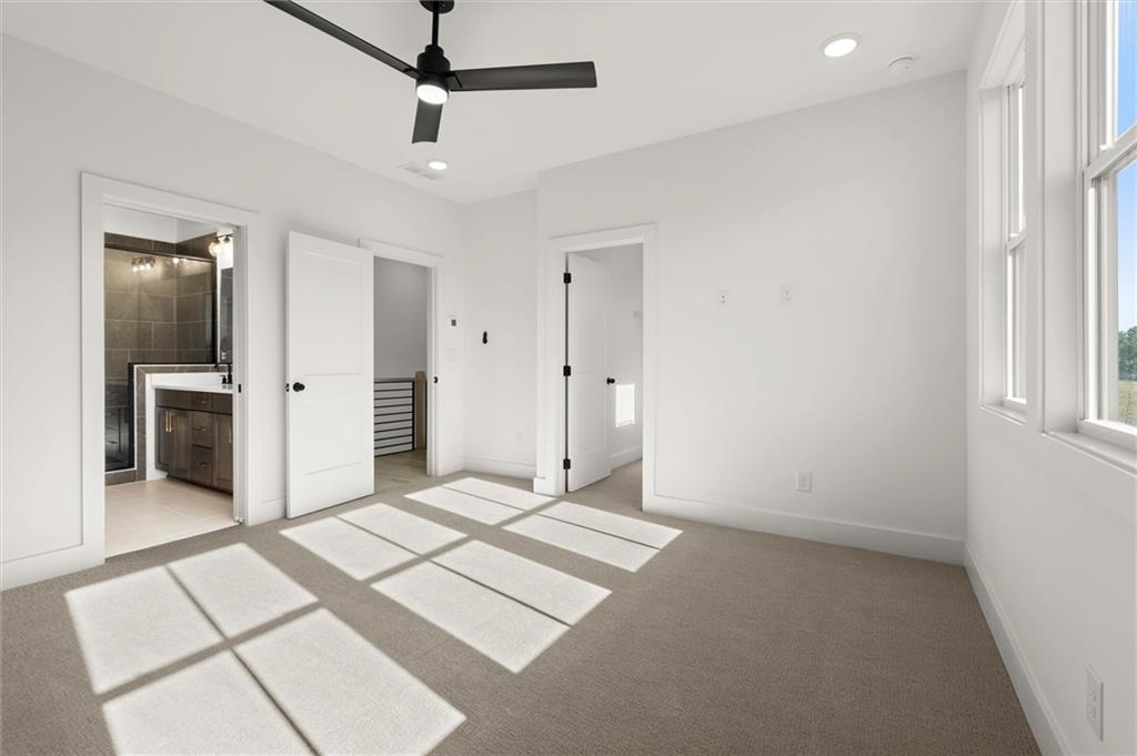 437 Mezzo Lane, Unit 87 Alpharetta, GA 30009 - Photo 24 of 46 an empty room with windows and cabinet