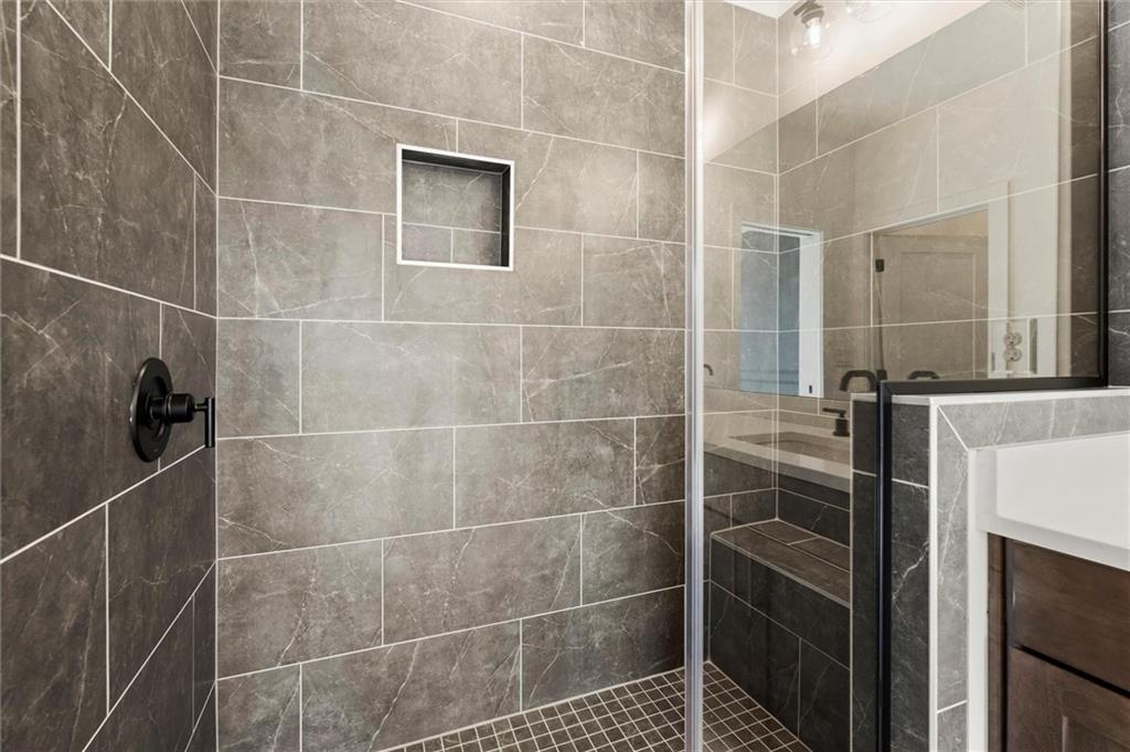 437 Mezzo Lane, Unit 87 Alpharetta, GA 30009 - Photo 26 of 46 a bathroom with a shower and a sink