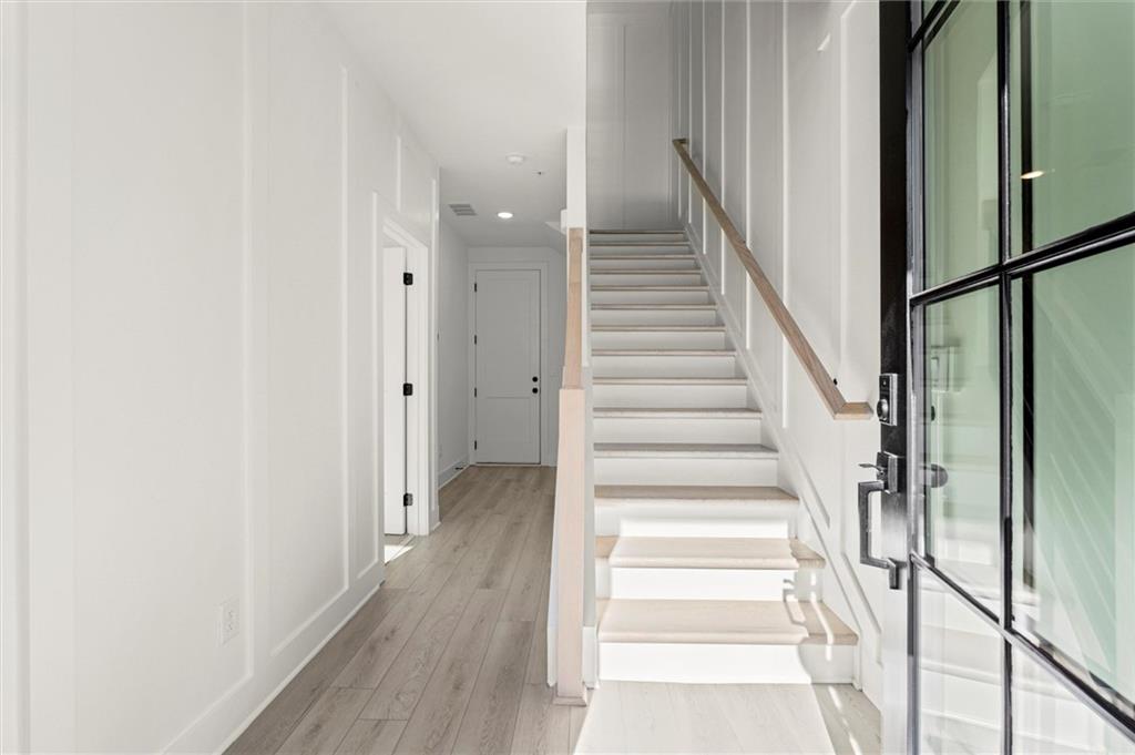 437 Mezzo Lane, Unit 87 Alpharetta, GA 30009 - Photo 3 of 46 a view of a hallway with wooden floor and entryway