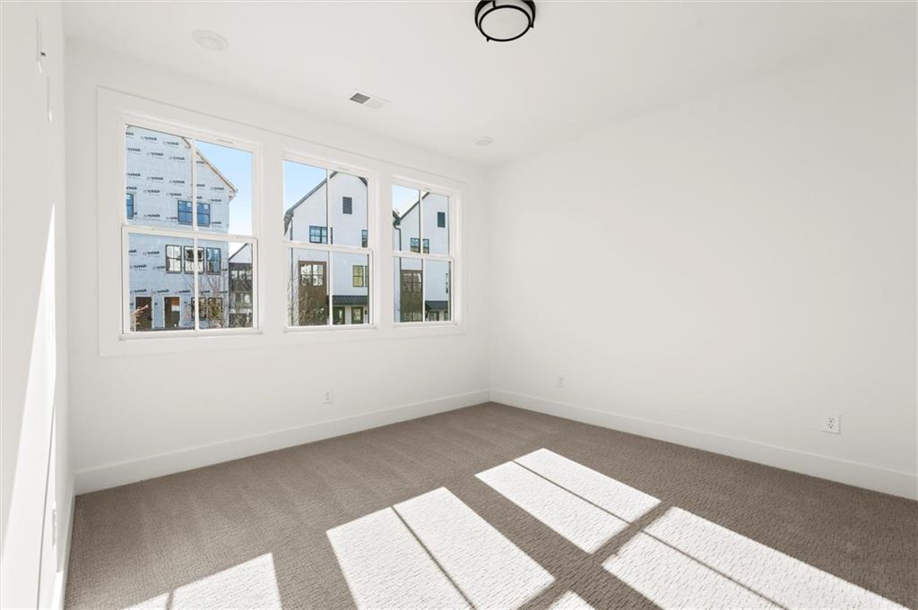 437 Mezzo Lane, Unit 87 Alpharetta, GA 30009 - Photo 4 of 46 a view of an empty room
