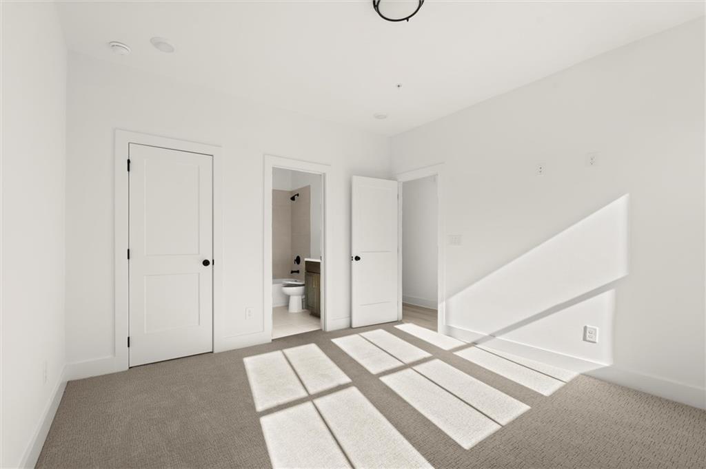 437 Mezzo Lane, Unit 87 Alpharetta, GA 30009 - Photo 5 of 46 a view of a bedroom with closet