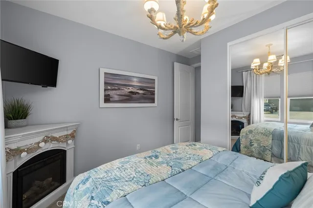 a bedroom with a bed and a television