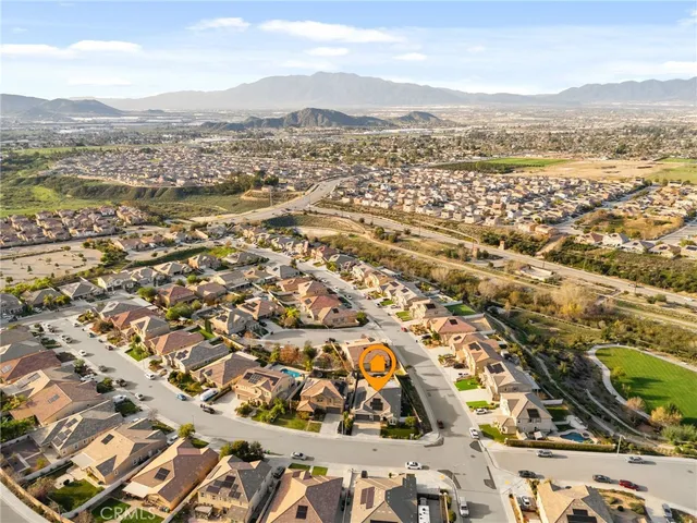an aerial view of residential houses with outdoor space