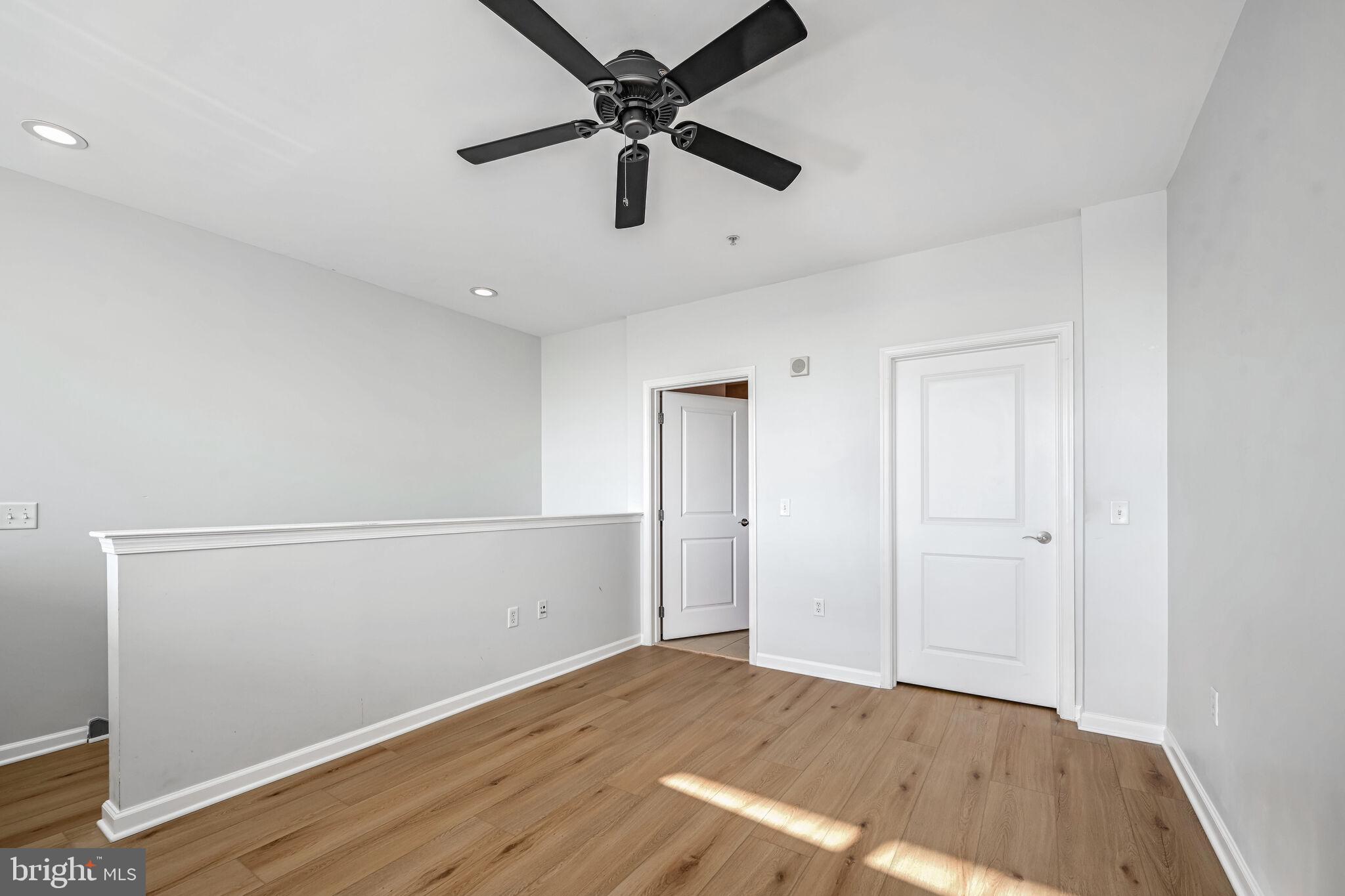 444 West Broad Street, Unit 619 Falls Church, VA 22046 - Photo 12 of 21 a view of an empty room and wooden floor