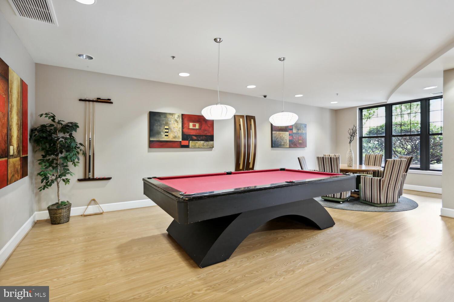 444 West Broad Street, Unit 619 Falls Church, VA 22046 - Photo 17 of 21 a room with table soccer and wooden floor