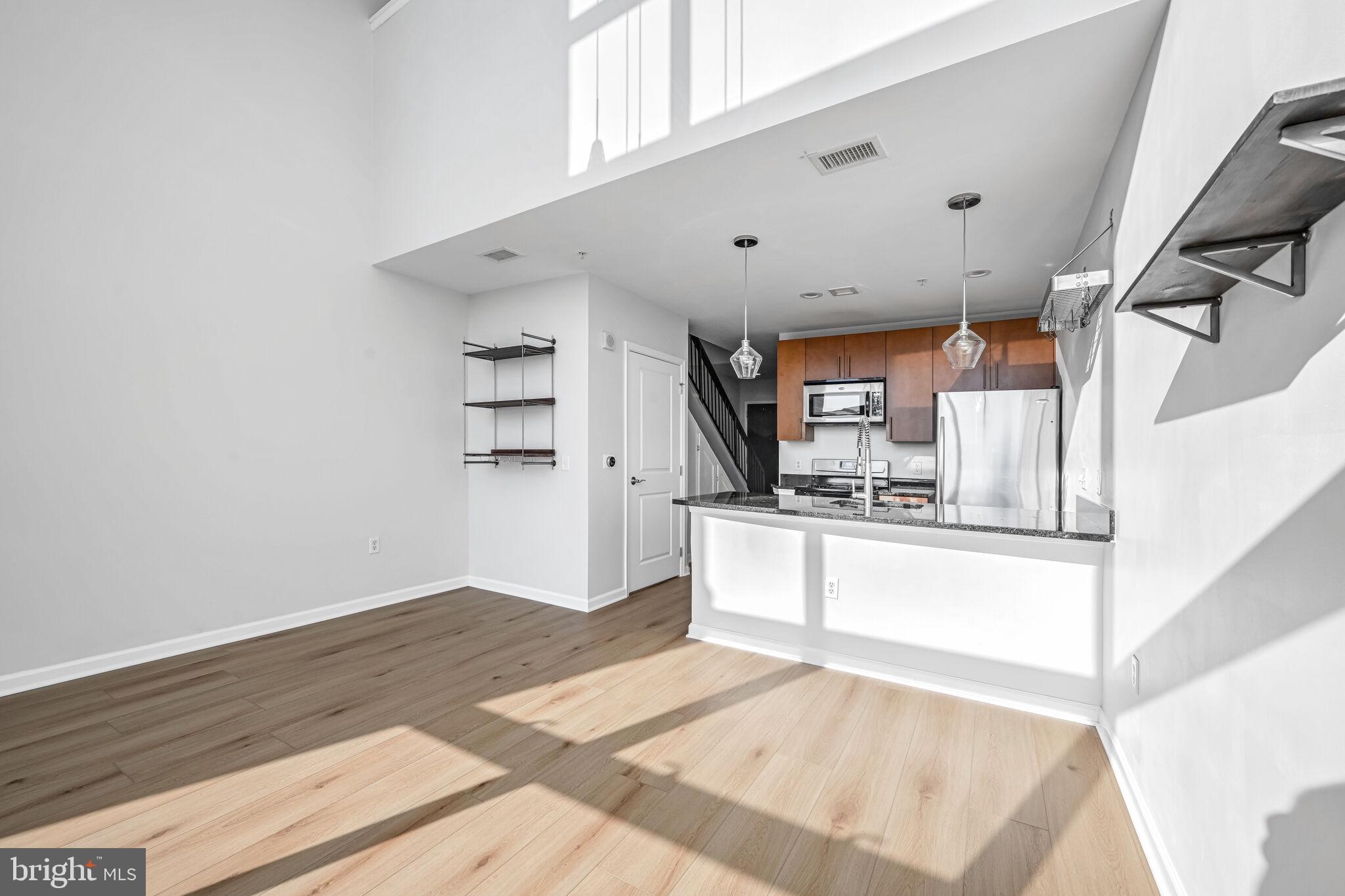 444 West Broad Street, Unit 619 Falls Church, VA 22046 - Photo 7 of 21 a view of kitchen with wooden floor