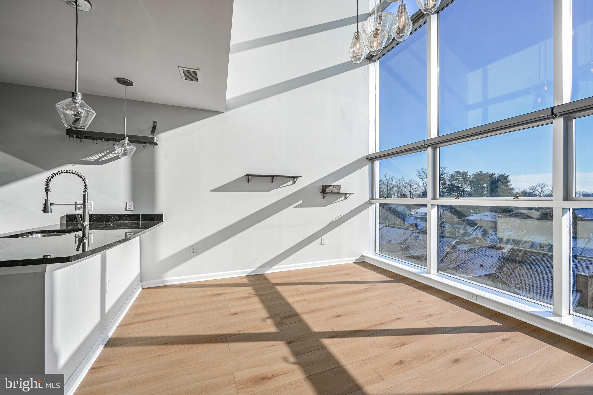 444 West Broad Street, Unit 619 Falls Church, VA 22046 - Photo 8 of 21 a view of a kitchen with a sink and cabinets