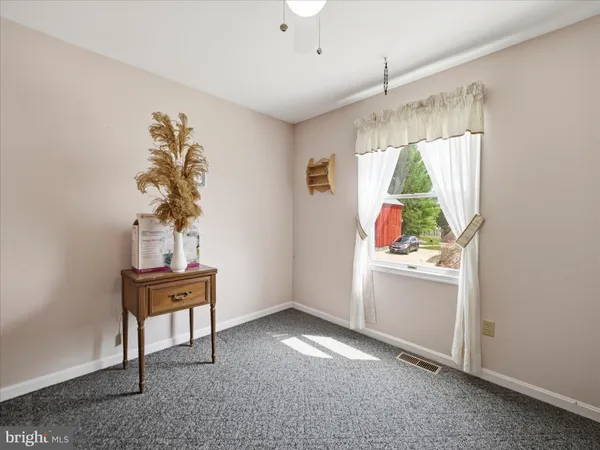 a workspace with furniture and window