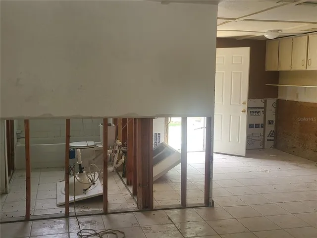 a view of a hallway with seating area