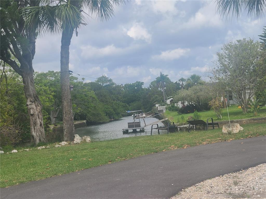 Undisclosed Address Hudson, FL 34667 - Photo 8 of 13 a view of a garden with an tree