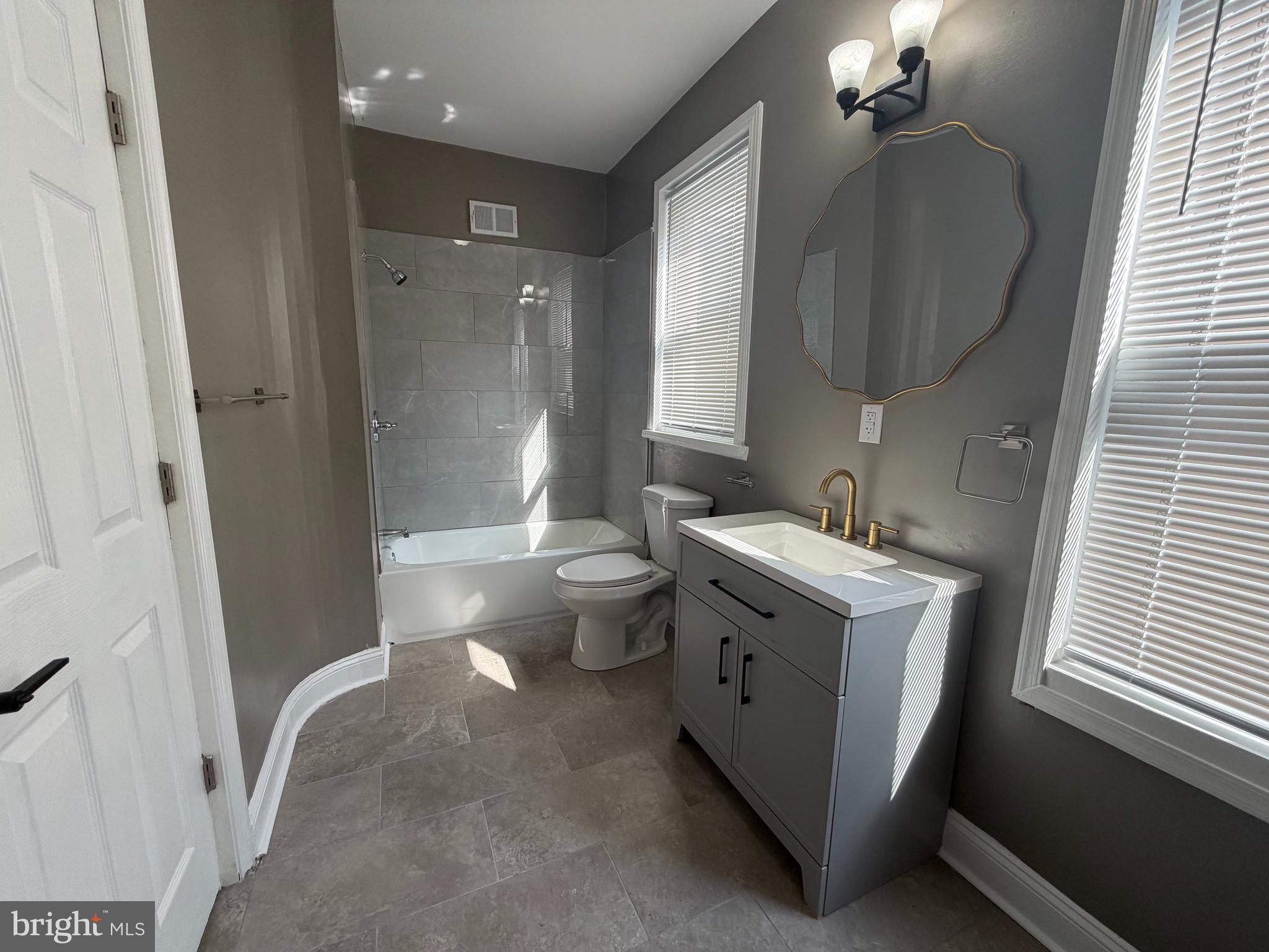 2260 North 18th Street Philadelphia, PA 19132 - Photo 11 of 13 a bathroom with a sink toilet and shower