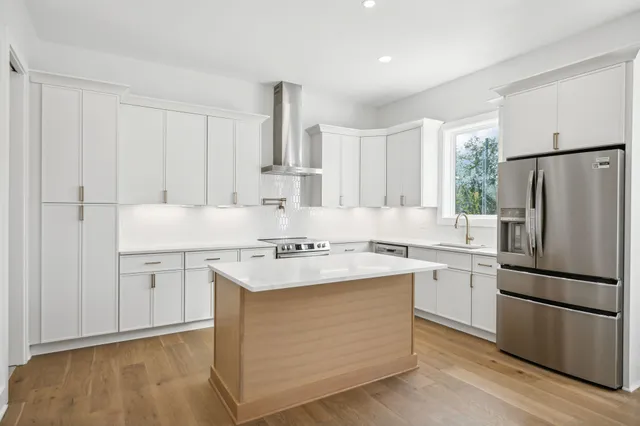a kitchen with a white cabinets and white appliances