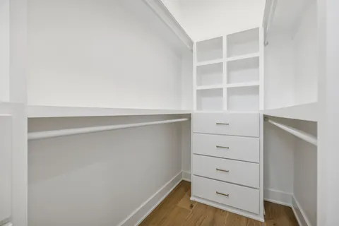 a view of an empty walk in closet